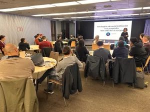 Claudia Badell kicking off the masterclass “Automation Strategies with Purpose: Beyond the Scripts” at Testearla 2025. Participants are seen attentively engaged in the session.