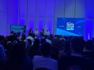 Claudia Badell, Julio César Oropeza, and Matías Fornara speaking at the Quality Sense Conf 2025 panel on how to sell testing solutions.